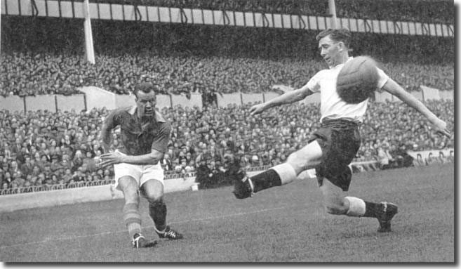 John Charles gets in a shot despite the lunge from Danny Blanchflower of Spurs