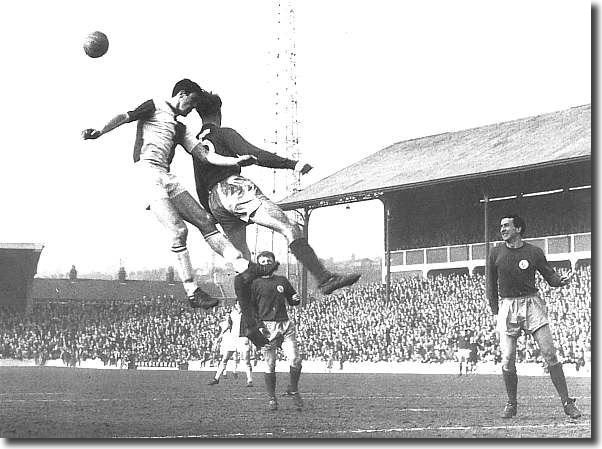 Mike O'Grady and Billy Bremner look on as Jack Charlton and Mike England of Blackburn duel it out at Ewood Park in March 1966