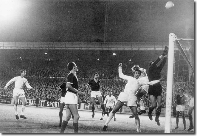 Dinamo goalkeeper koric fists the ball over the bar under pressure from Belfitt and Bremner during another United raid at Elland Road