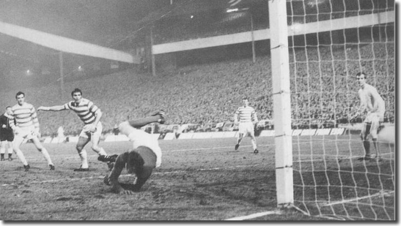 David Harvey is beaten and Paul Madeley can only watch as this strike from Celtic's Bobby Murdoch (out of picture) enters the net to give the Scots a 3-1 aggregate lead