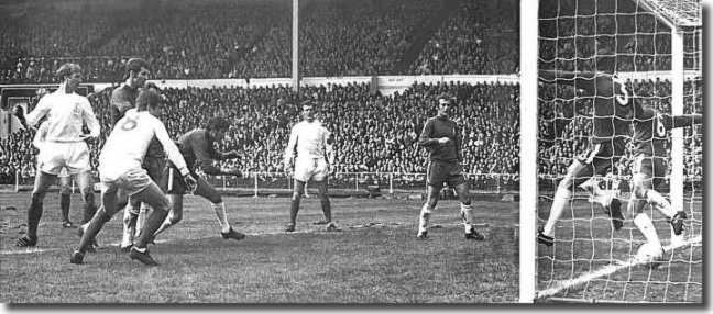 Charlton (far left) watches as his header beats two Chelsea defenders on the line to give Leeds the lead in the FA Cup final