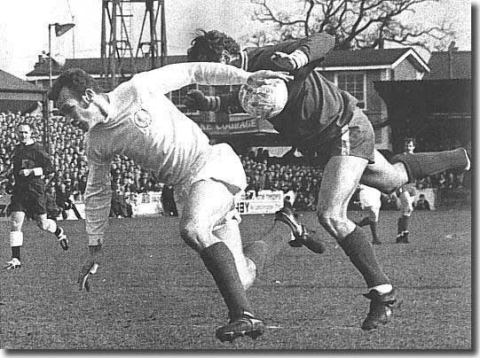 Paul Reaney and Ray Crawford take a tumble - moments later Crawford put Colchester two up