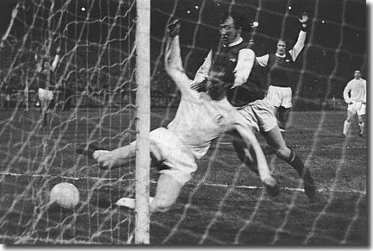 Jack Charlton beats Arsenal's Bob McNab to force home a controversial goal against Arsenal