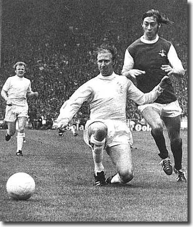 Under pressure from Charlie George, Jack Charlton concedes the corner that almost led to Alan Ball opening the scoring