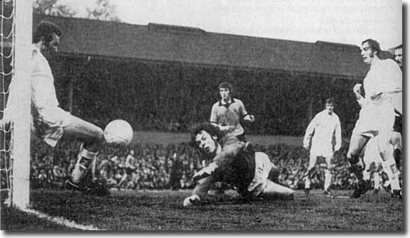 Wolves' Frank Munro scores despite the best efforts of Paul Reaney and David Harvey in the crucial Molineux clash on 8 May