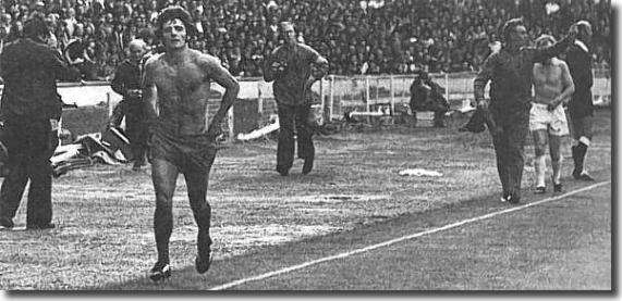 Shirtless Kevin Keegan and Billy Bremner take the long walk following their dismissal during the 1974 Charity Shield match