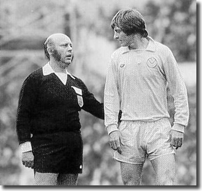 Referee Roger Kirkpatrick chats to Allan Clarke during the game