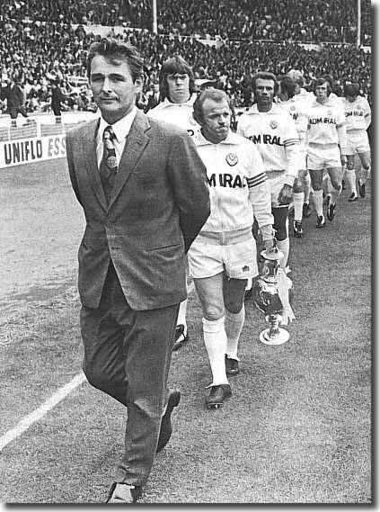 Brian Clough leads out a very glum looking set of Leeds players for the FA Charity Shield match in 1974