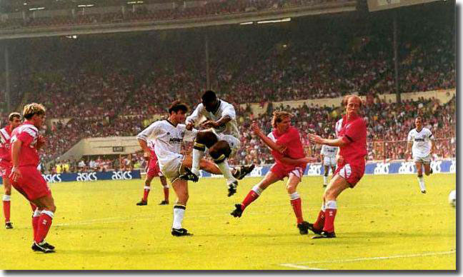 Cantona scoring his second and Leeds' third goal in the 4-3 victory over Liverpool in the 1992 Charity Shield match