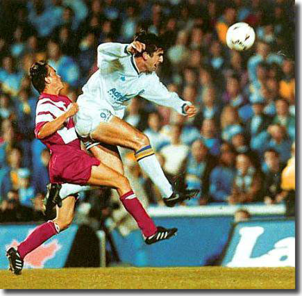 Cantona terrorises the Stuttgart defence in the match at Elland Road