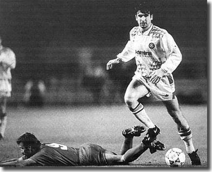 Leeds lost the first leg of their European Cup tie at Stuttgart 3-0 - Cantona here gives the Germans some concern