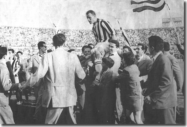 Charles is chaired off the pitch by jubilant fans after Juve's championship win in 1958