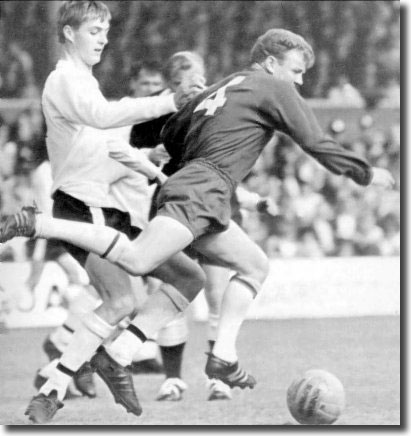 A young Allan Clarke of Fulham attempts to take out Billy Bremner during the clash at Craven Cottage on 17 September - the match finished 2-2