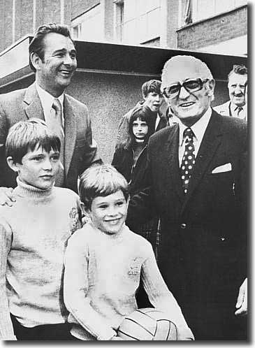 Happy days at the start of Brian Clough's reign as chairman Manny Cussins welcomes the new manager  and his sons as he takes the reins at Elland Road