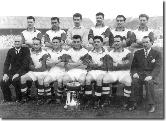 Bobby Collins is third right in the front row with the Celtic team in 1957 which won the Scottish League Cup Back: Goldie, Fallon, Beattie, Mcphail, Fernie, Evans. Front: Johnstone (trainer), Tully, Collins, Peacock, Wilson, Mochan, Jimmy McGrory (manager)