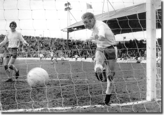 Bobby Collins slams home a goal against Rangers in 1970 with Joe Jordan in close attendance