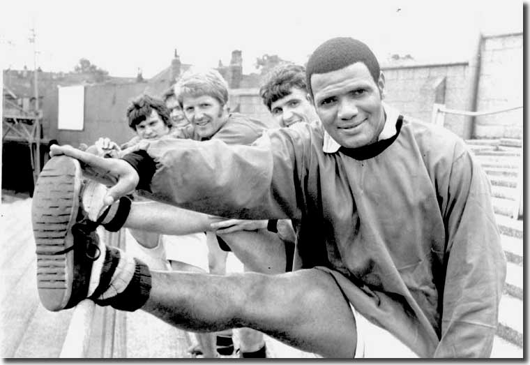 Albert Johanneson limbers up with the York City players