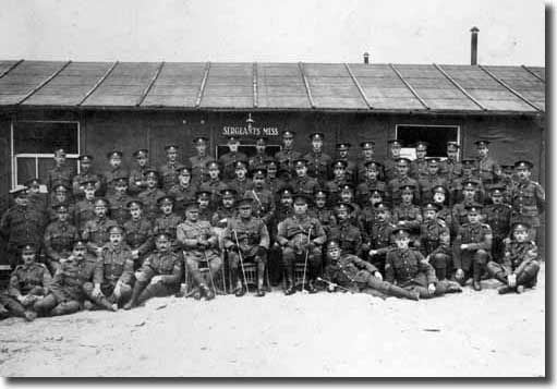 A photograph of the Leeds Pals Senior NCOs grouped in front of the Sergeant's Mess in February 1916