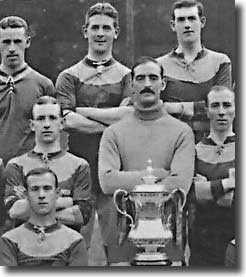 Evelyn Lintott is in the middle of the back row of this photograph of Bradford City's FA Cup winning squad of 1911 - Lintott didn't play in the final and moved to Leeds City a year later