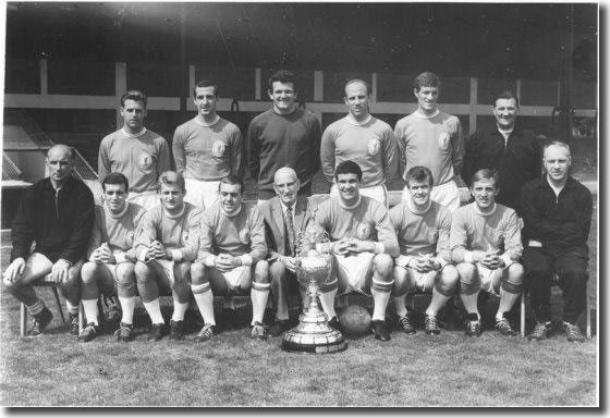 Liverpool 1963-64 with the championship trophy - Back: Milne, Byrne, Lawrence, Moran, Stevenson, Paisley (Trainer) - Front: Bennett (Coach), Callaghan, Hunt, St John, Williams (President), Yeats, Arrowsmith, Thompson, Shankly (Manager)