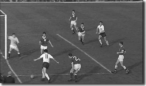 Mike O'Grady (11) flashes over a centre against Northern Ireland with Alan Peacock moving in for the kill - the chance was missed - 20 October 1962