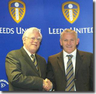 Professor John McKenzie shakes hands with manager Peter Reid to usher in another not so brave new world