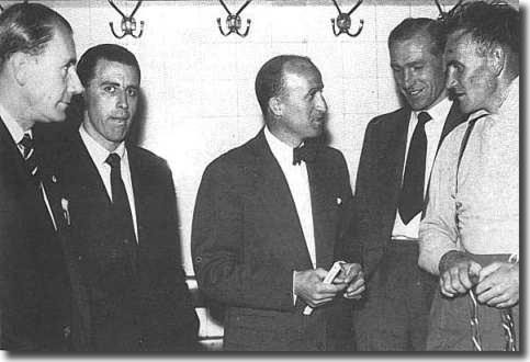 Manchester City on tour in Germany in 1955.  Les McDowall and Roy Paul look on as Bert Trautmann and Don Revie talk to a German official