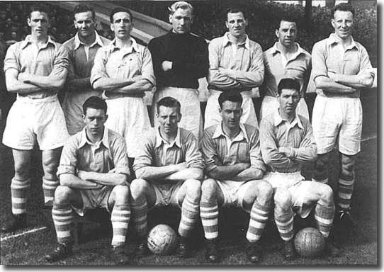 Manchester City 1953-54.  Back: Ken Branagan, Don Revie, Ken Barnes, Bert Trautmann, Jimmy Meadows, Roy Paul, Dave Ewing.  Front: Fionan Fagan, Roy Little, Johnny Hart, Roy Clarke