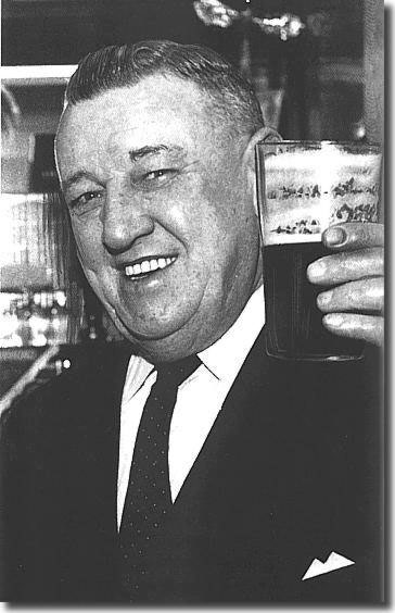 Chairman Harry Reynolds raises his glass - he uncorked the champagne after a famous victory at Swansea