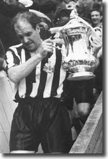 Jimmy Scoular lifts the FA Cup for Newcastle in 1955 after beating Manchester City