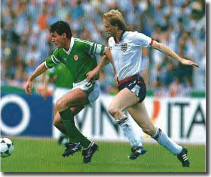 Frank Stapleton holds off Mark Wright of England